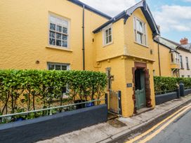 A house with a green door and windows at The Old Vicarage in Carmarthen