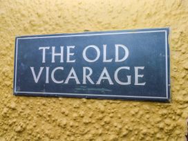 A sign with the name The Old Vicarage