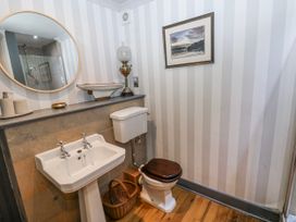 A bathroom with a sink and toilet at The Old Vicarage in Carmarthen