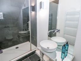 A bathroom with a shower and sink at The Old Vicarage in Carmarthen