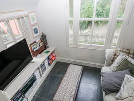 A living room with a television and a sofa at The Old Vicarage in Carmarthen