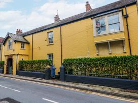 A house with a hedge and windows at The Old Vicarage in Carmarthen