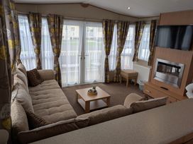 A living room with a sofa and coffee table at 42 Laurel Rise in Primrose Valley