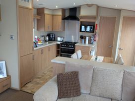 A kitchen with cabinets and appliances at 42 Laurel Rise in Primrose Valley