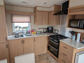 A kitchen with cabinets and appliances at 42 Laurel Rise Primrose Valley