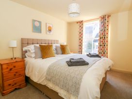 A bedroom with a bed and bedside table at The Old Post Office in York