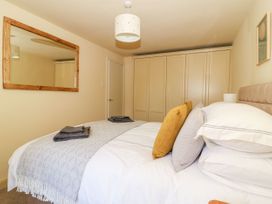 A bedroom with a bed and wardrobe at The Old Post Office in York