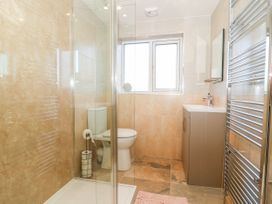 A bathroom with a shower, toilet, and sink at The Old Post Office in York