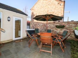 An outdoor seating area with a table and chairs at The Old Post Office in York