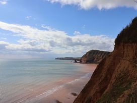 A coastal view with a cliff and sea at 4 Peaslands Road Sidmouth