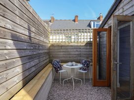 A garden area with a table and chairs at 4 Peaslands Road Sidmouth