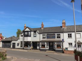 A building exterior of Volunteer Inn on a street in Sidmouth