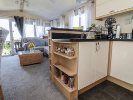 A living room with a sofa and coffee table at 33 Pendle View in Clitheroe