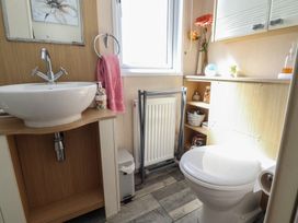 A bathroom with a wash basin and toilet at 33 Pendle View in Clitheroe