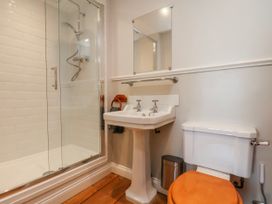 A bathroom with a shower and sink at Holly Cottage in Whitby