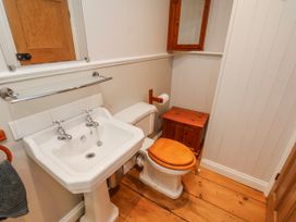 A bathroom with a sink and toilet at Holly Cottage in Whitby