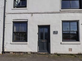 An exterior view of a building with a door and windows at Marina Side in Whitby