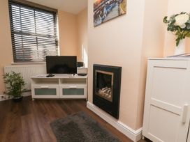 A living room with a tv and fireplace at Marina Side in Whitby