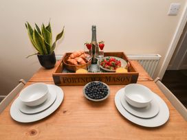 A dining table with food and drinks at Marina Side in Whitby
