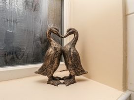 A decorative duck figurine on a windowsill at Marina Side in Whitby