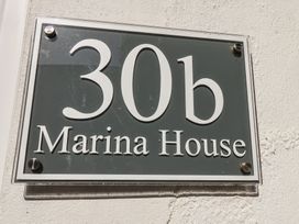 A sign displaying 30b Marina House