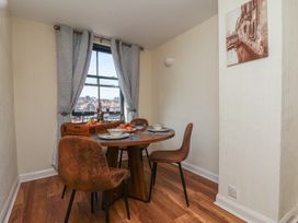 A dining room with a table and chairs at Marina House in Whitby
