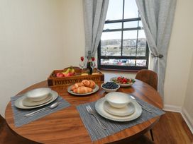 A dining room with a table set for a meal at Marina House in Whitby