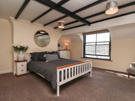 A bedroom with a bed and furniture at Marina House in Whitby