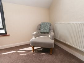 A chair near a radiator in a sitting room at Marina House in Whitby