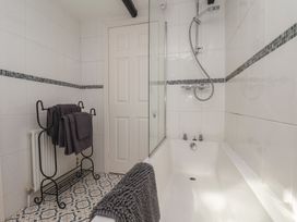 A bathroom with a bathtub and shower at Marina House in Whitby