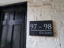 A door with a nameplate at G's Loft in Whitby