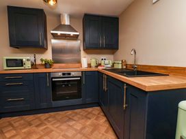 A kitchen with cabinets and countertop at G's Loft in Whitby