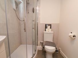 A bathroom with a shower and toilet at G's Loft in Whitby