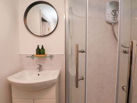 A bathroom with a shower and sink at G's Loft in Whitby