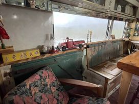 A living room with a toy truck and a lantern at 2 x Double Bed Glamping Wagon at Dalby Forest Scarborough