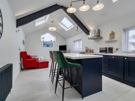 A kitchen with a styled island and seating area at Modern Seaside Cottage - Sleeps 5 in Paignton
