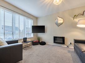 A living room with a television and a sofa at 2 Bed House - Sleeps 4 - Garden - Parking - Wifi in Kendal