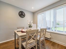 A dining room with a table and chairs at 2 Bed House - Sleeps 4 - Garden - Parking - Wifi, Kendal