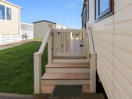 Stairs leading to a doorway at CaravanSleeps6-FreeParking-QuietRetreat-Nature in Paignton