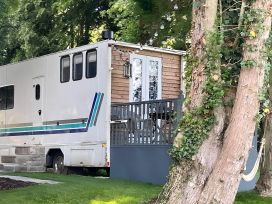 A mobile home with a wooden deck in The Lake District Cockermouth