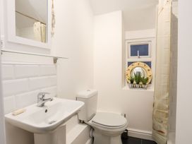 A bathroom with a sink and toilet at Rhiwlas in Rhosneigr