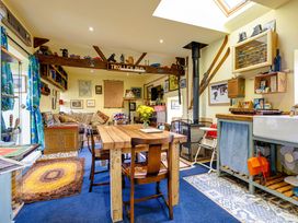 A living room with a table and sofa in Family Country Cottage with a private Valley View