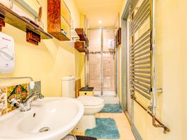 A bathroom with a sink, toilet, and shower at Family Country Cottage with a private Valley View