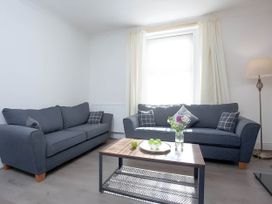 A living room with sofas and a coffee table at Torquay - House - Sleeps 6 - Pet Friendly