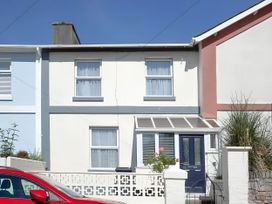 A house with a garden and car at Torquay - House - Sleeps 6 - Pet Friendly