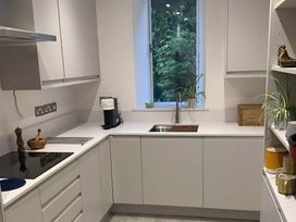 A kitchen with a sink and coffee machine at Beachside 2-Bed - Sleeps 4, Parking & Pet Friendly, Salcombe