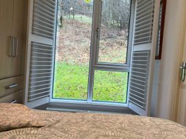 A bedroom with a window and bed at 2 Bed Lodge-Sleeps 4-stunning views -Pet Friendly, Troutbeck