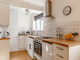 A kitchen with appliances including a kettle and microwave at Luxury 2 Bed Room Lake View Apt Bowness Parking