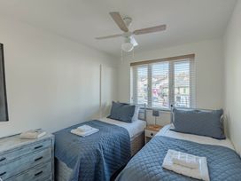 A bedroom with two beds and a window at Luxury 2 Bed Room Lake View Apt Bowness Parking Bowness-On-Windermere