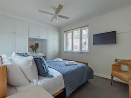 A bedroom with a bed and a television at Luxury 2 Bed Room Lake View Apt Bowness Parking Bowness-On-Windermere